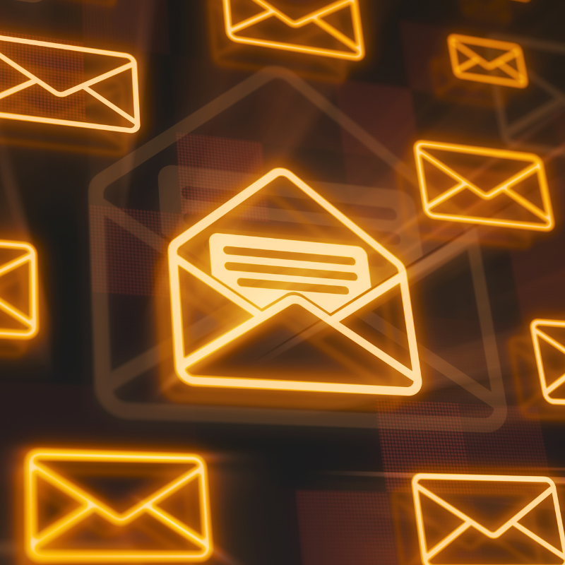 A digital collage of closed letters representing emails. One letter is open in the middle.