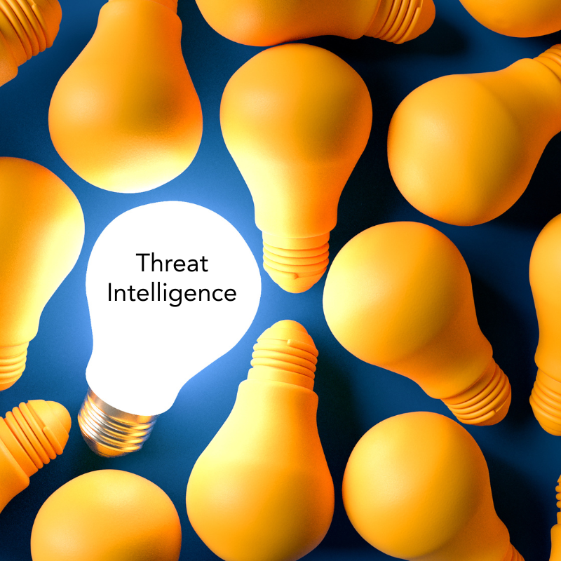 A pile of yellow light bulbs. One is lit up white and says "Threat Intelligence"