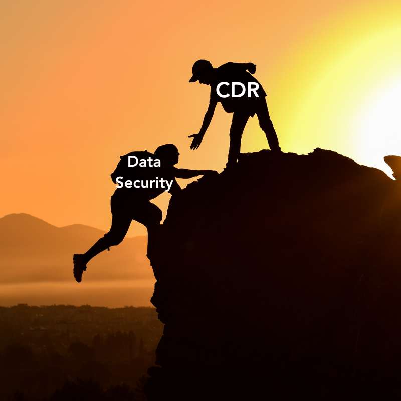 Two silhouettes on a mountain. One captioned "CDR" holds out their hand to help up another titled "Data Security"