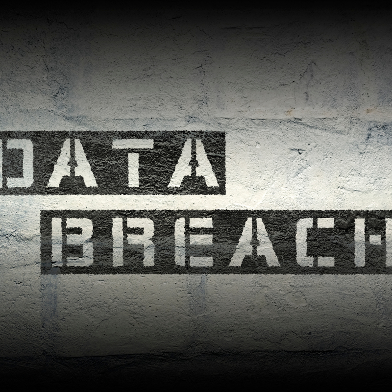 Data Breach on a brick wall