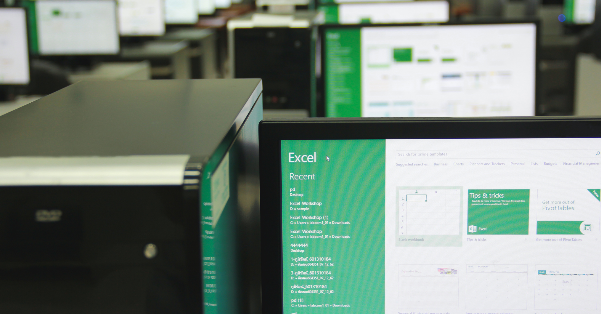 Computers with Excel open - Votiro